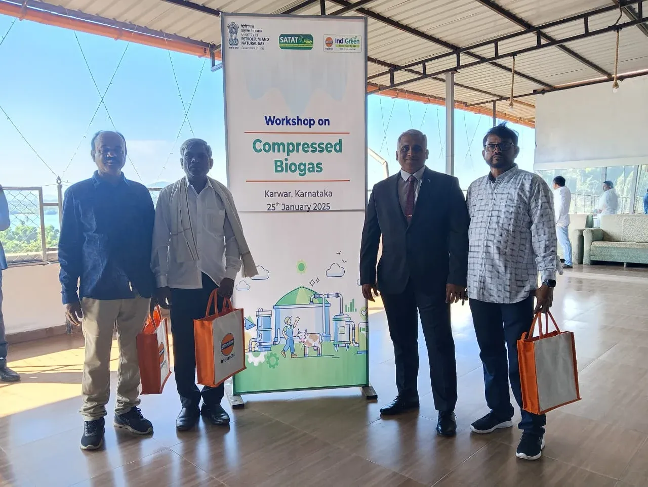 A lamp-lighting ceremony at the Compressed Biogas workshop banner