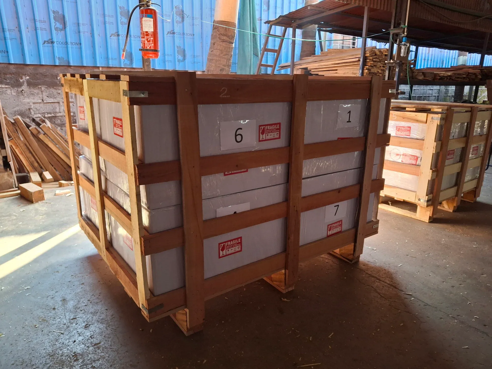 Wooden export crates numbered and strapped on pallets