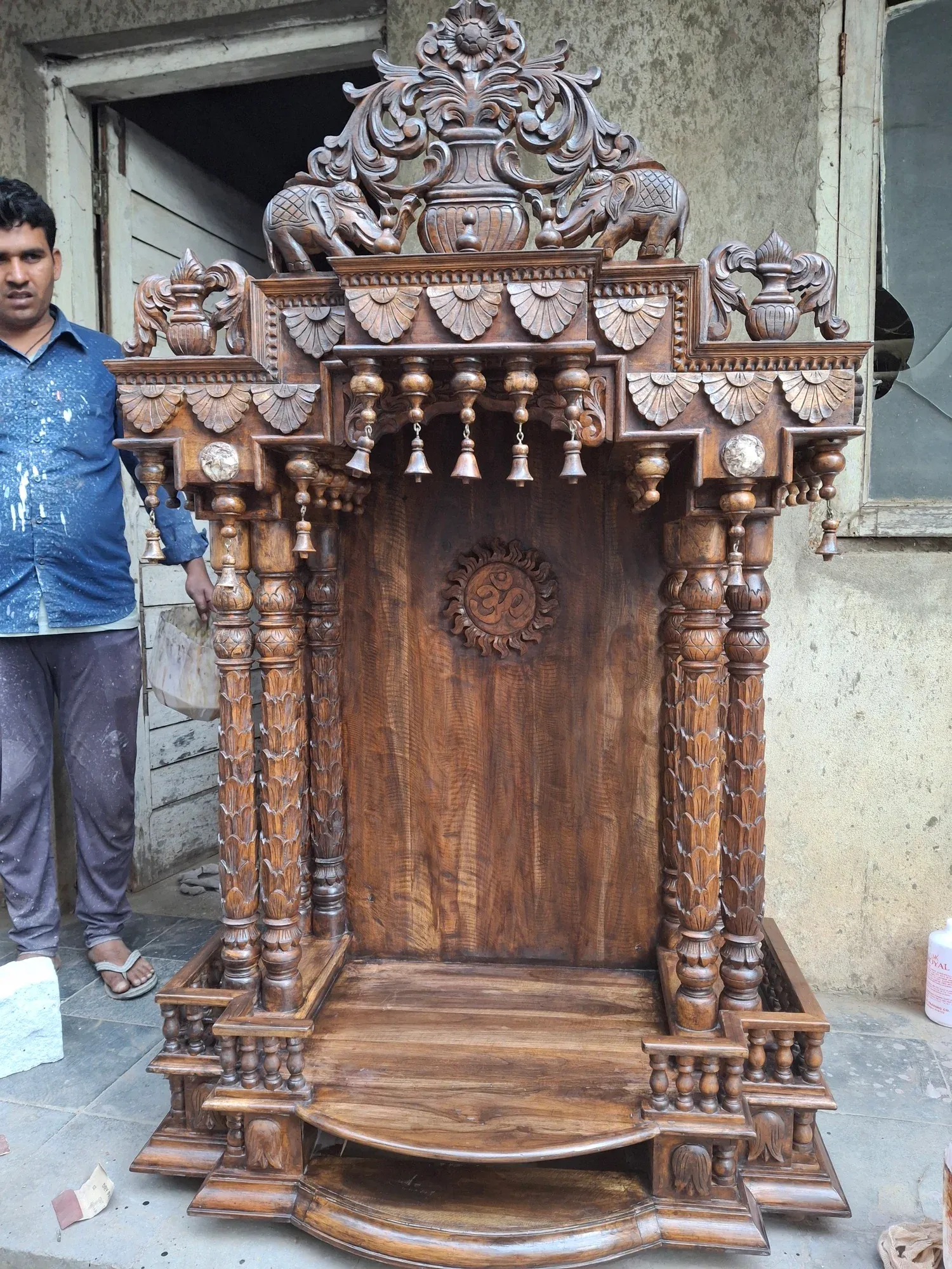 A carved sagwan wood temple shrine made by local artisans
